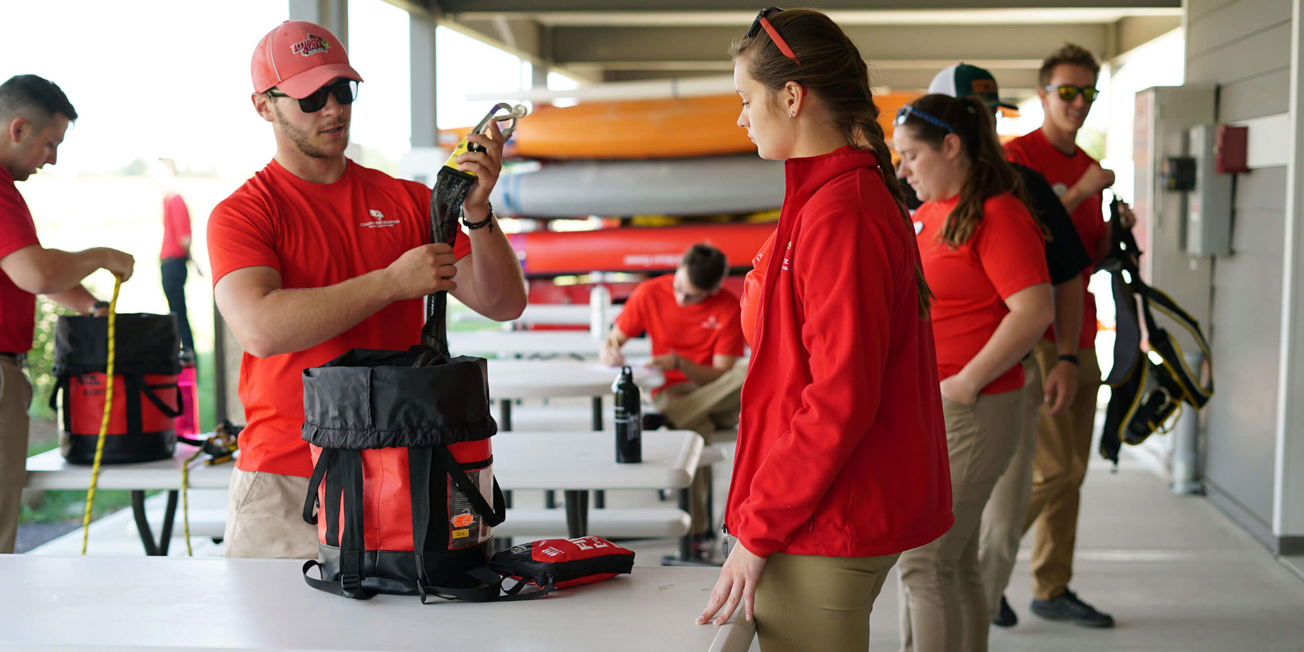 Student team members working at the Redbird Adventure Center